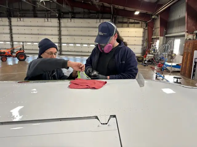 Aircraft engine being inspected by a Penn Air Repair technician